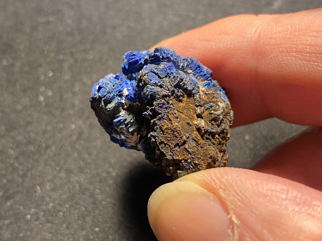 This Azurite crystal has some oxidation and a thin coating of copper related minerals.