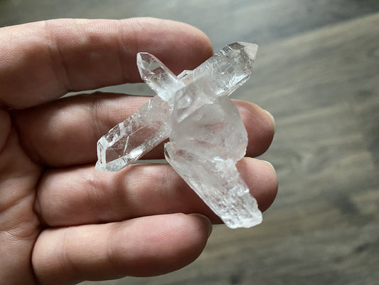 A natural cross of super clear quartz from Corinto, Brazil.  This piece would look great as a wire-wrapped pendant!  One of a kind!