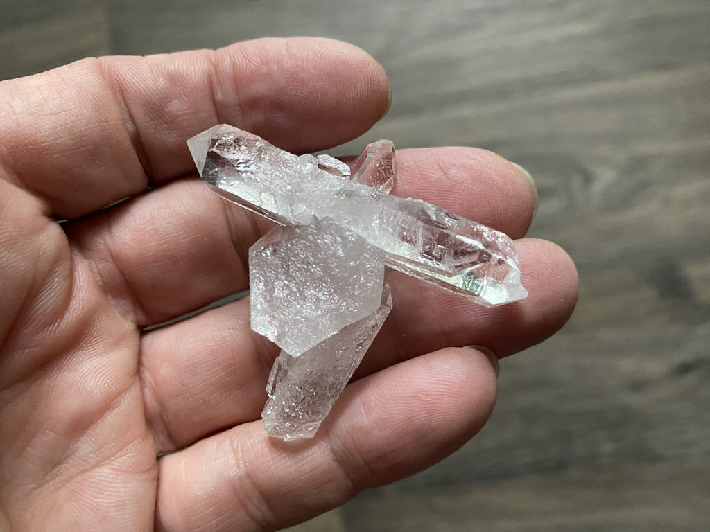 This lightweight quartz cluster from Corinto is one of the finest we've ever seen from this area in Brazil or anywhere. Formed into a naturally cross, this piece would make an awesome pendant, altar piece or top piece for a powerful staff.  